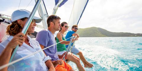 Four people on sailing yacht