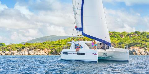 family on sailing catamaran in the BVI
