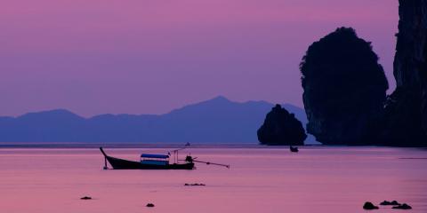 Purple sunset across Thailand beach