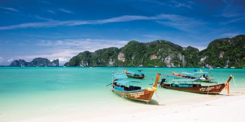 Boats anchored in sea