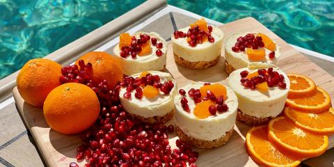 Mini cheesecakes with pomegranate and orange on board a Moorings 4500