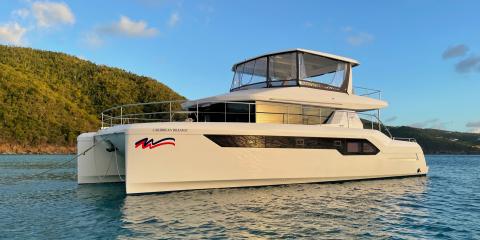 Sun reflecting off of Moorings 534 power cat