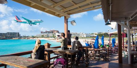 Plane flying over St Maarten Beach