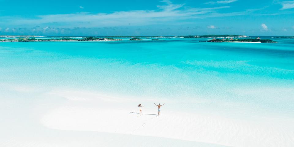 Drone photo of couple on beach in Bahamas Drone photo of couple on beach in Bahamas