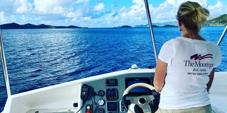Chef Rosie at the helm in the BVI Chef Rosie at the helm in the BVI