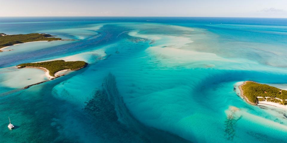 Sailing catamaran in the endless Exumas, Bahamas Sailing catamaran in the endless Exumas, Bahamas