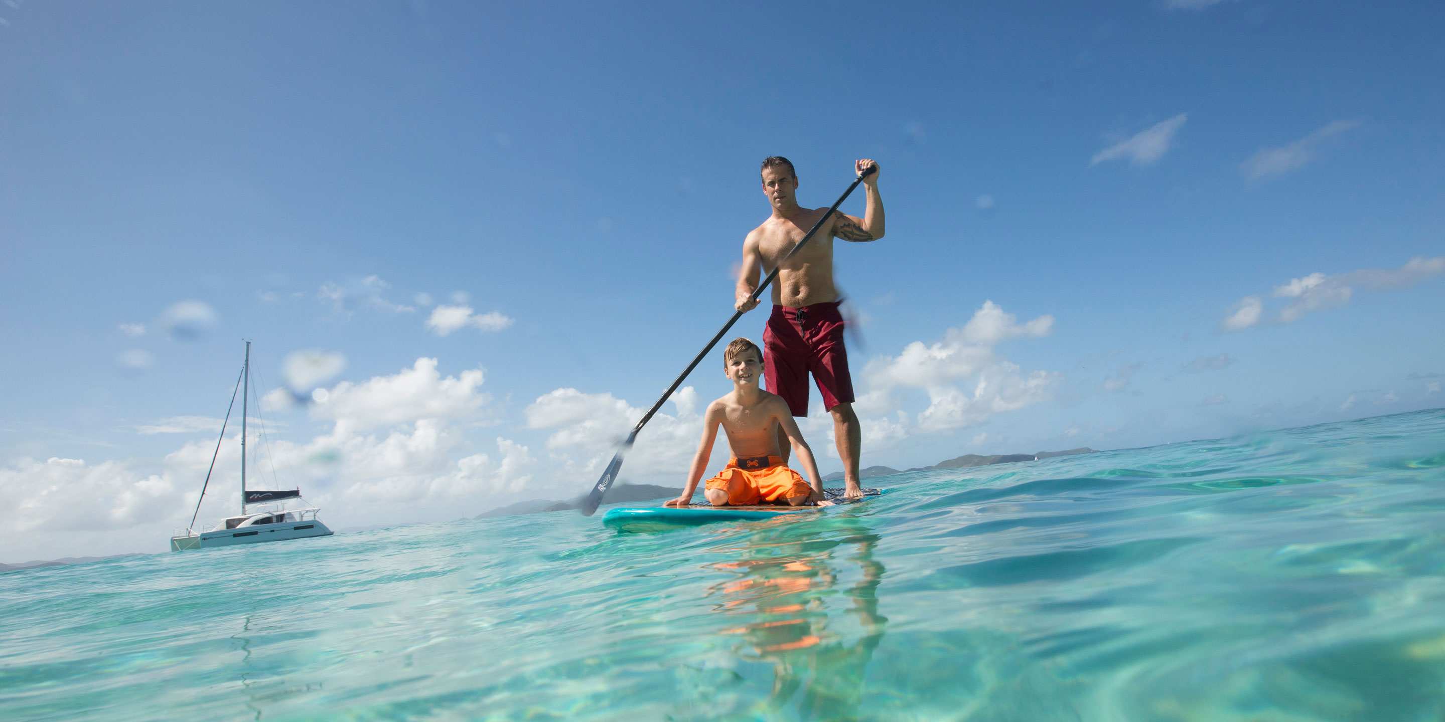father-son-paddleboarding-bvi-2880x1440-